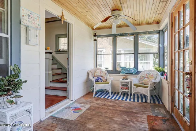 a dining room with furniture entryway and wooden floor