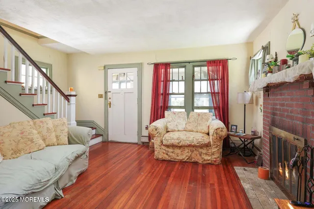 a bedroom with furniture and a wooden floor