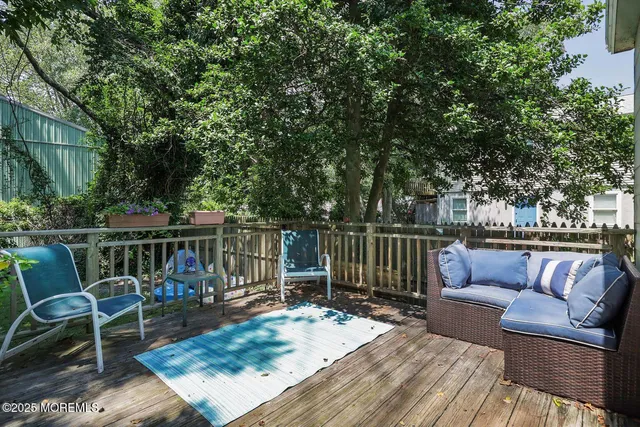 a view of a chairs and tables in the back yard of the house