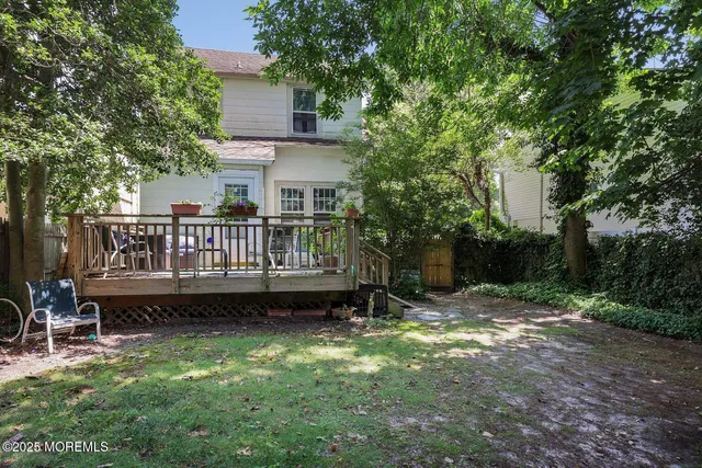 a view of a chair and table in backyard