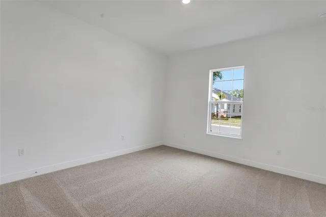 a view of an empty room and window