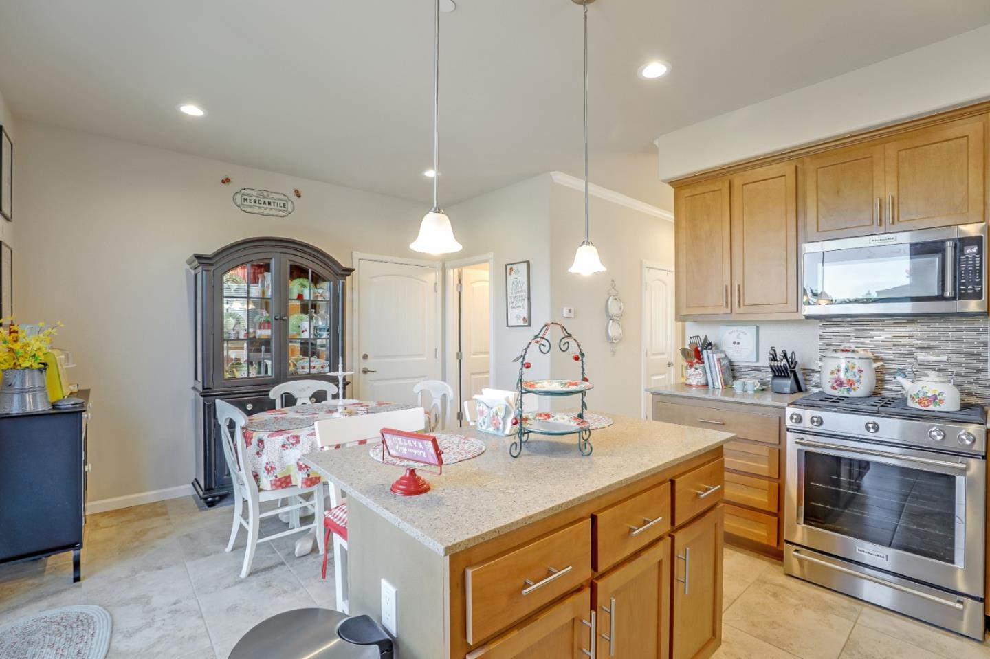 260 Springtime Circle Hollister, CA 95023 - Photo 12 of 46 a kitchen with stainless steel appliances kitchen island granite countertop a sink and cabinets
