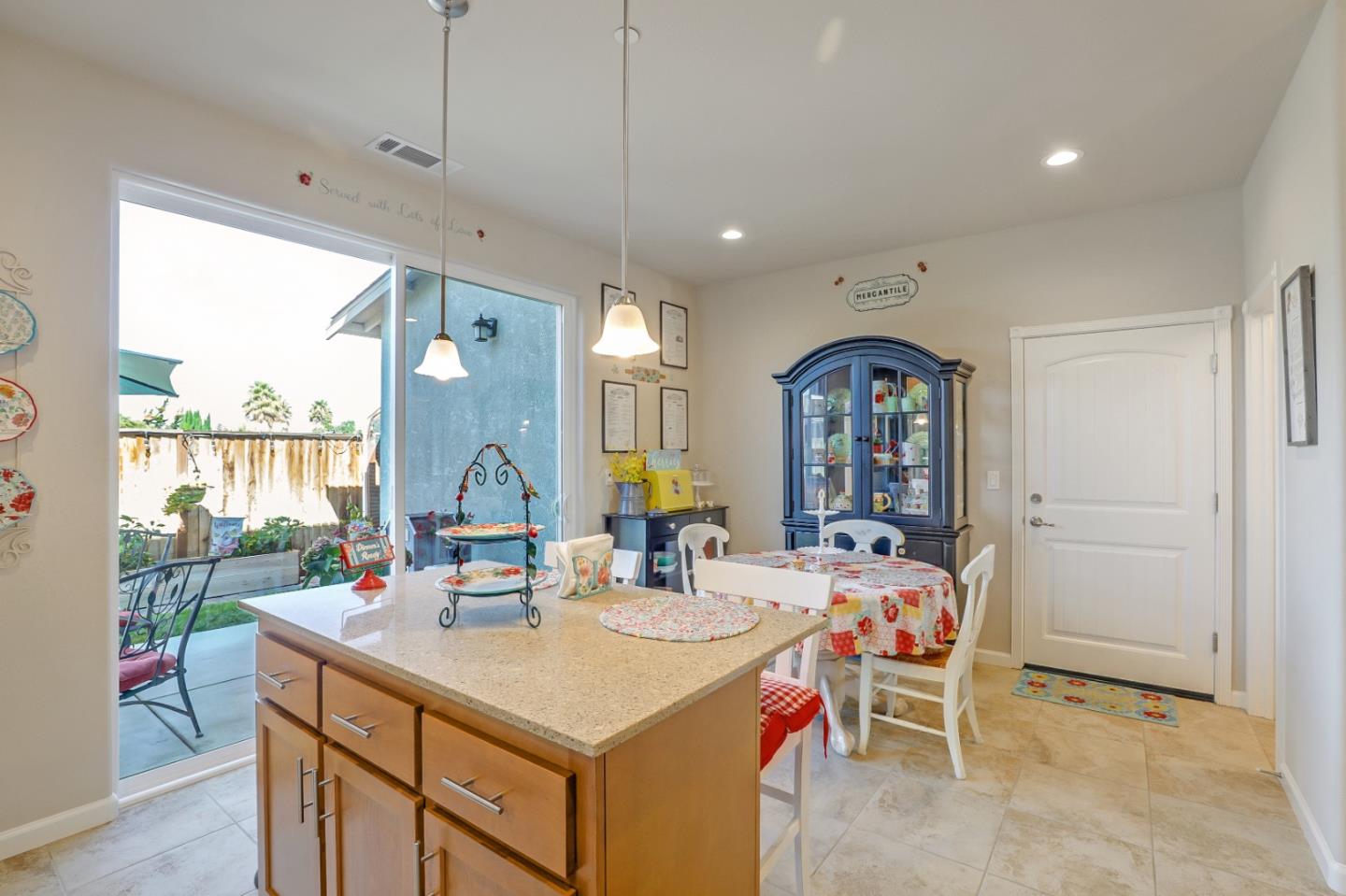 260 Springtime Circle Hollister, CA 95023 - Photo 13 of 46 a view of a kitchen from a dining room with a large window