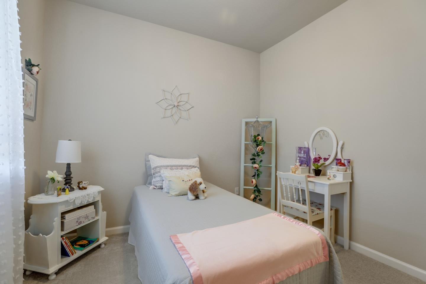 260 Springtime Circle Hollister, CA 95023 - Photo 27 of 46 a bedroom with a bed and wooden floor