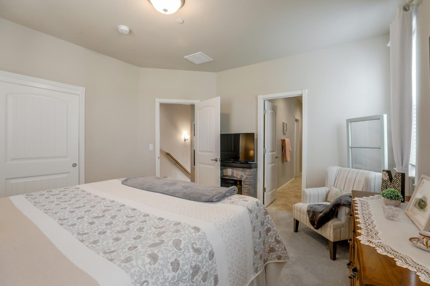 260 Springtime Circle Hollister, CA 95023 - Photo 33 of 46 a bedroom with a bed and glass windows