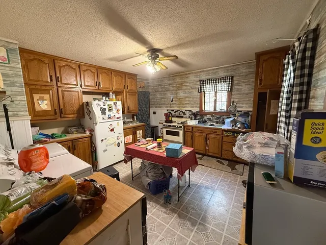 a living room with furniture and a gym machine