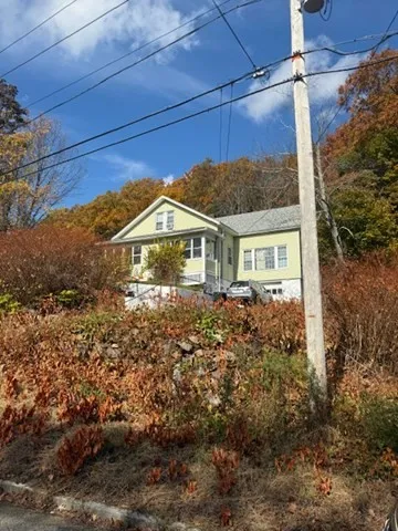 a view of a house with a yard