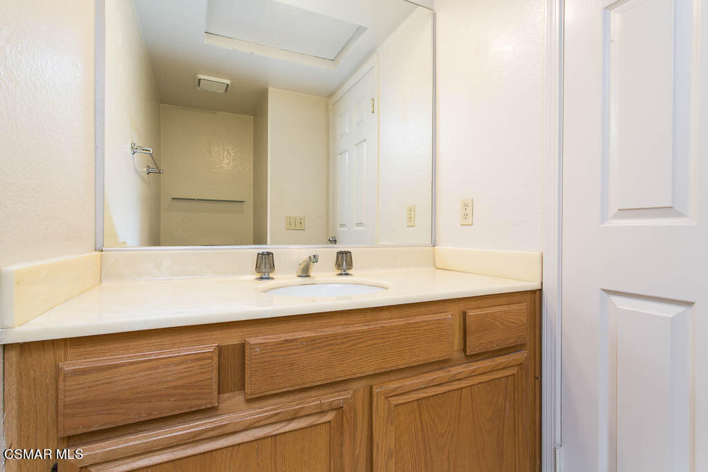 753 Congressional Road Simi Valley, CA 93065 - Photo 15 of 37 a bathroom with a sink and a mirror