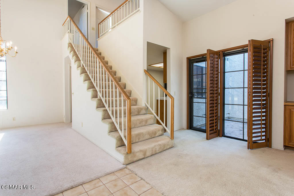 753 Congressional Road Simi Valley, CA 93065 - Photo 3 of 37 a view of an empty room with stairs and a couch