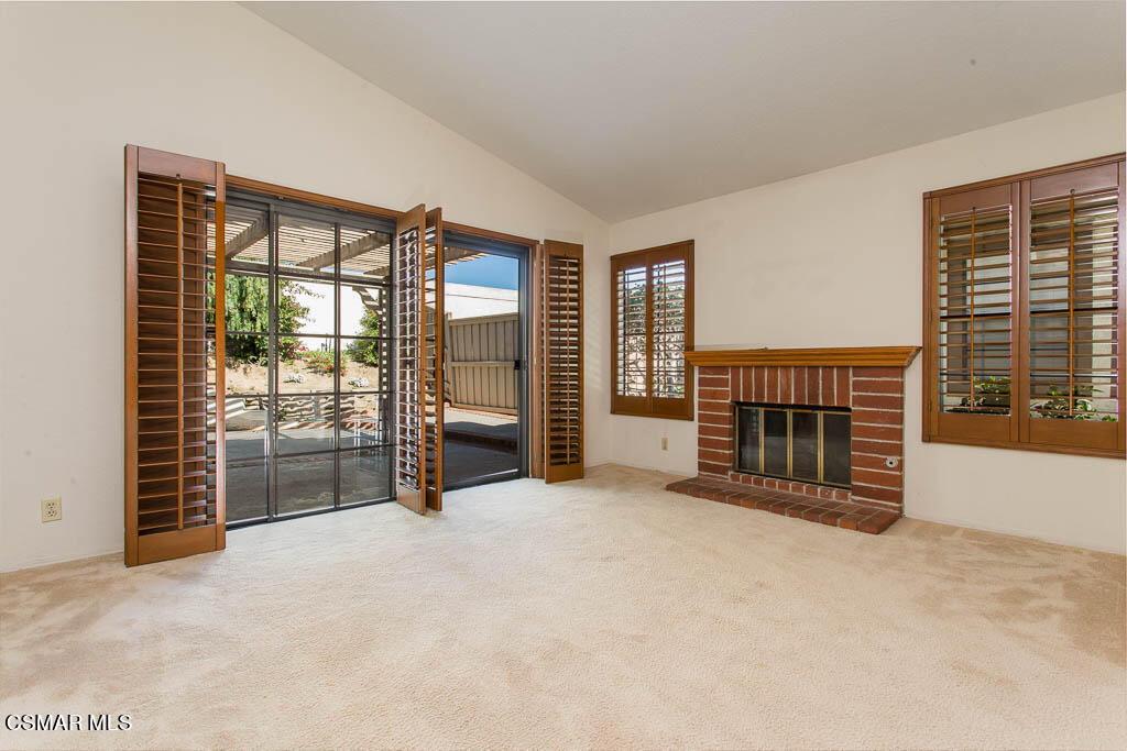 753 Congressional Road Simi Valley, CA 93065 - Photo 5 of 37 an empty room with furniture and a fireplace