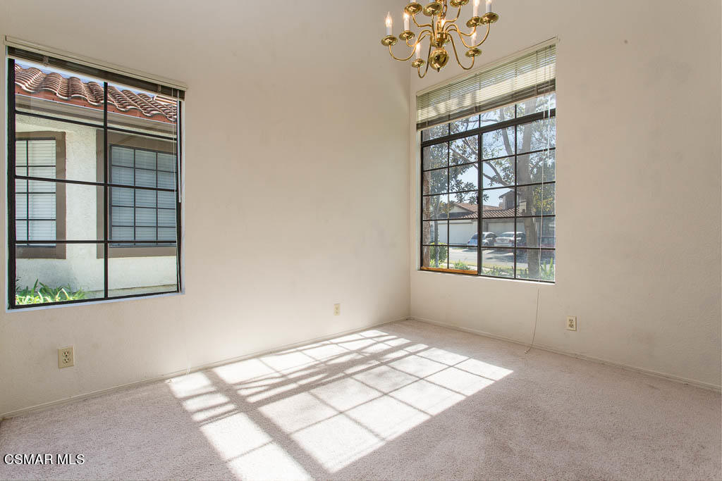 753 Congressional Road Simi Valley, CA 93065 - Photo 9 of 37 an empty room with windows and chandelier fan