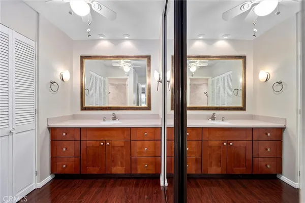 a bathroom with a double vanity sink and a mirror