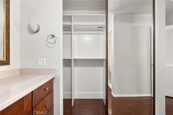 a bathroom with a shower sink and mirror