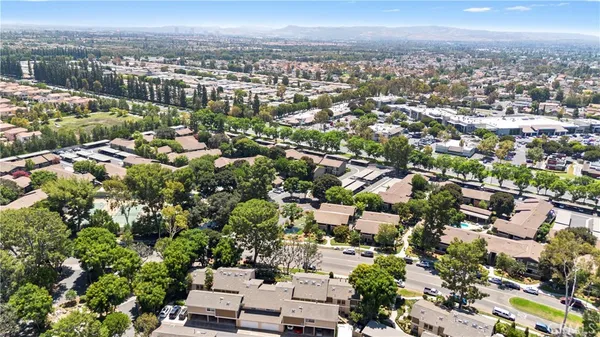 an aerial view of residential houses with outdoor space