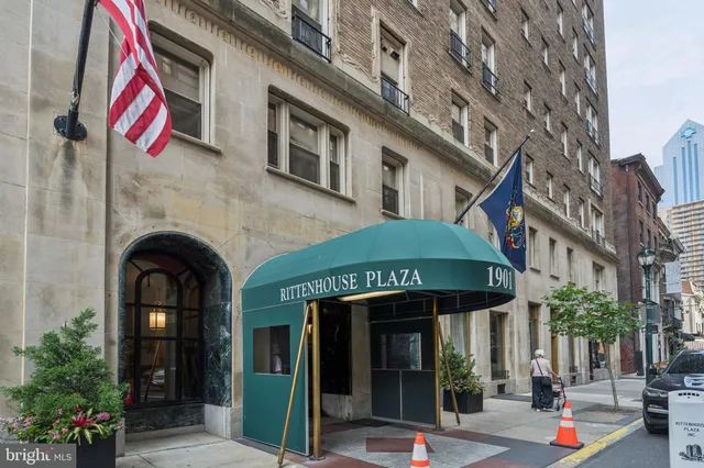 a front view of a building with retail shops