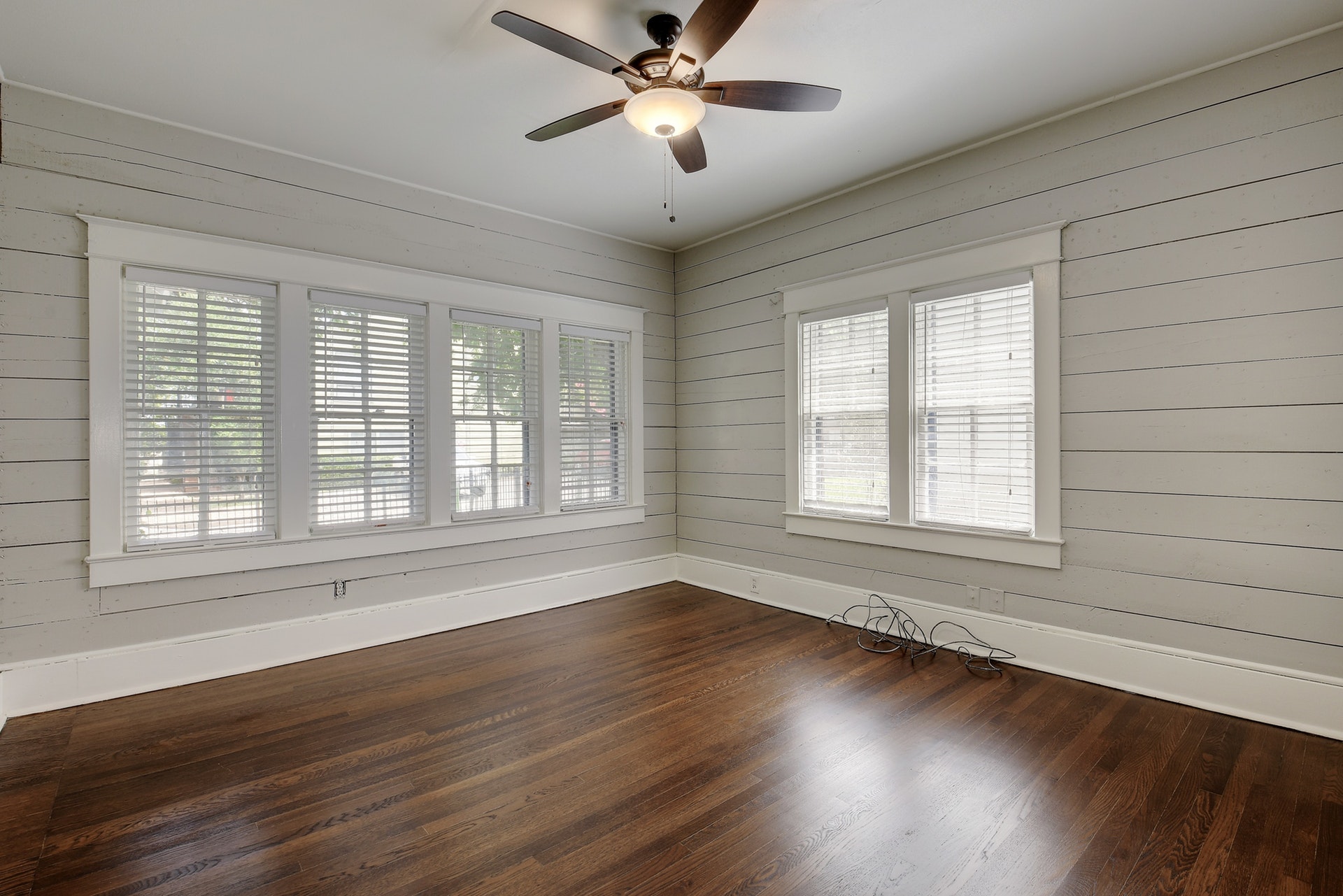903 Shoal Cliff Court Austin, TX 78705 - Photo 11 of 32 a view of an empty room with wooden floor and a window