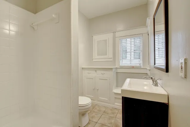 a bathroom with a sink toilet and vanity