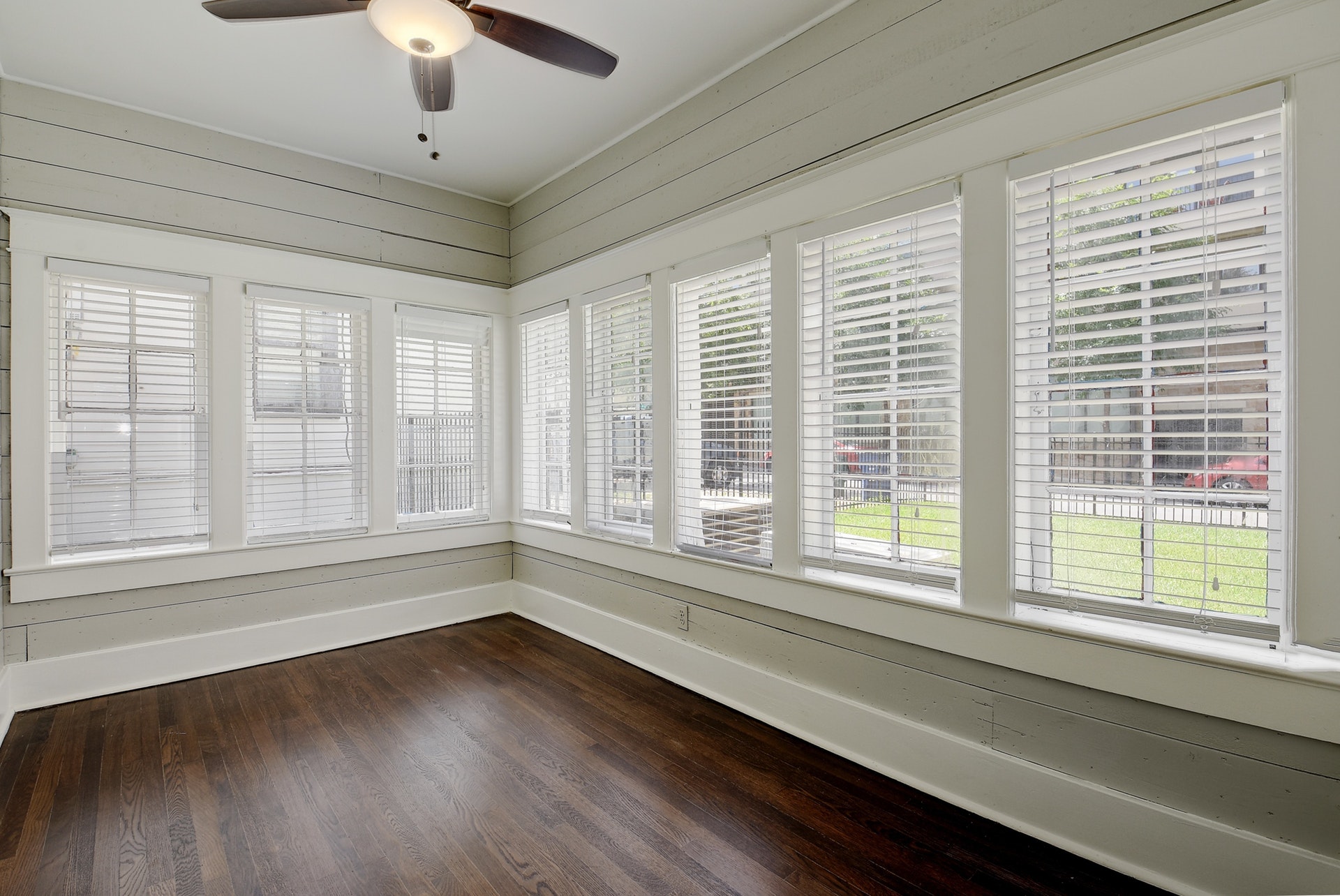 903 Shoal Cliff Court Austin, TX 78705 - Photo 15 of 32 a view of an empty room with a window and wooden floor