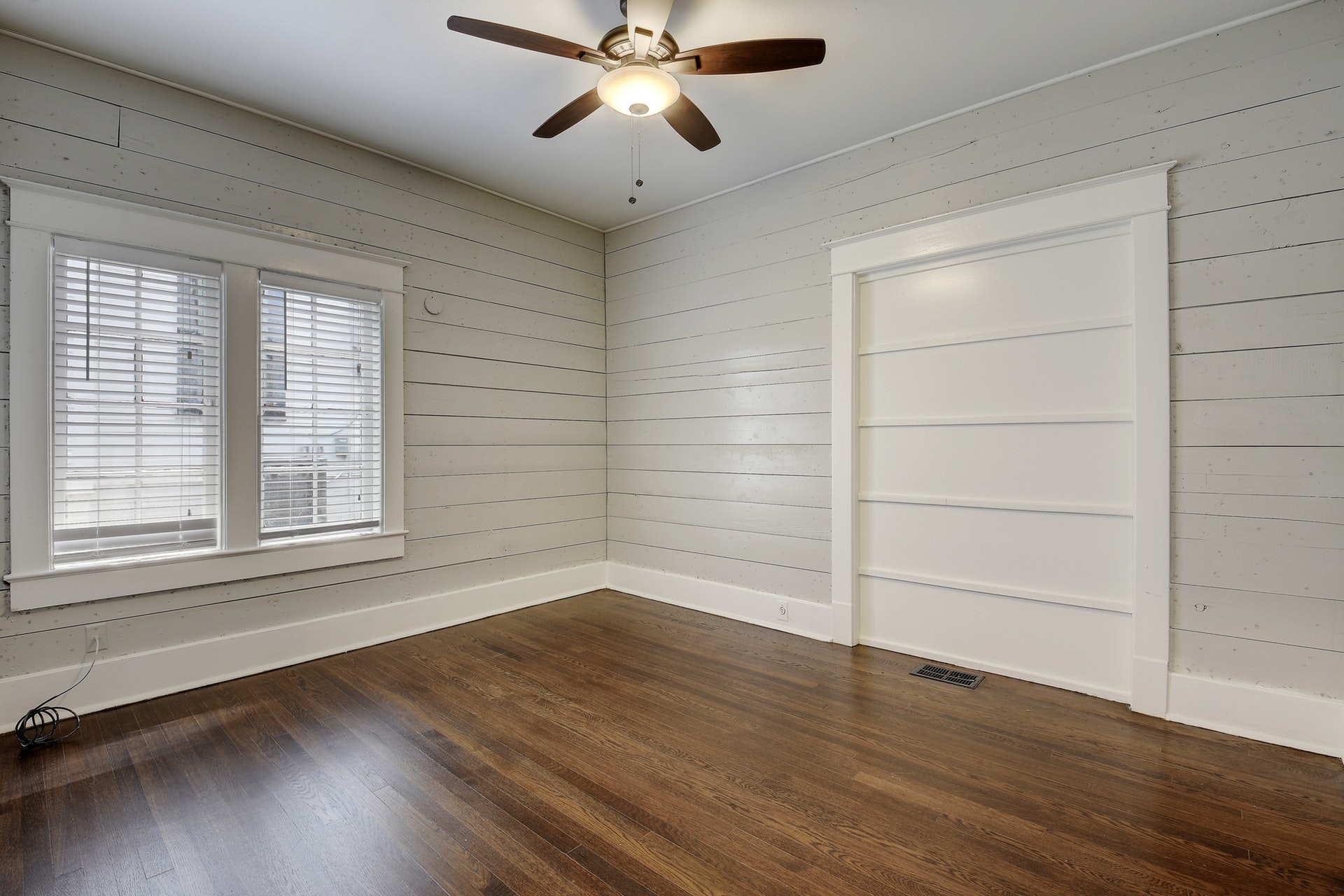 903 Shoal Cliff Court Austin, TX 78705 - Photo 16 of 32 a view of an empty room with wooden floor and a window