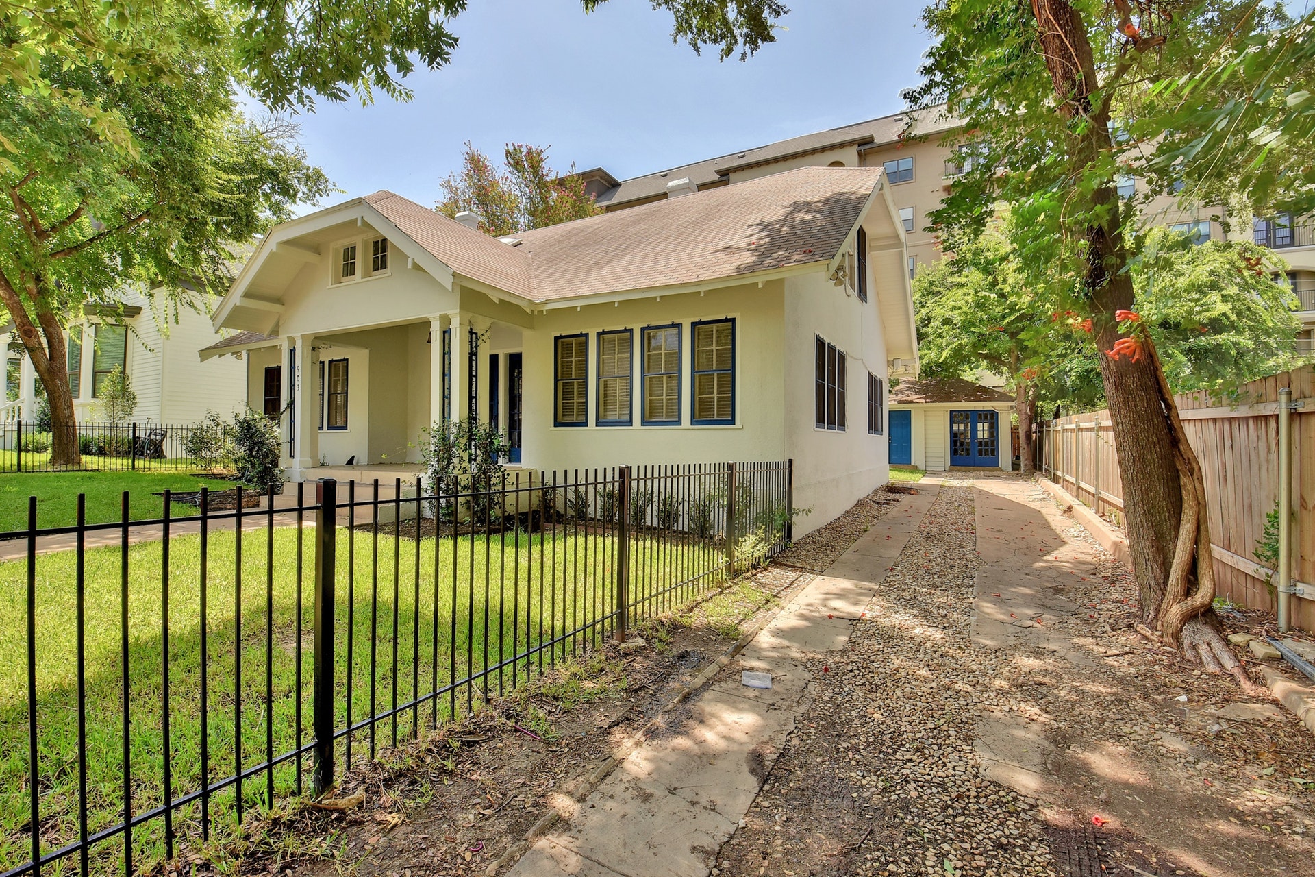 903 Shoal Cliff Court Austin, TX 78705 - Photo 2 of 32 a front view of a house with a yard