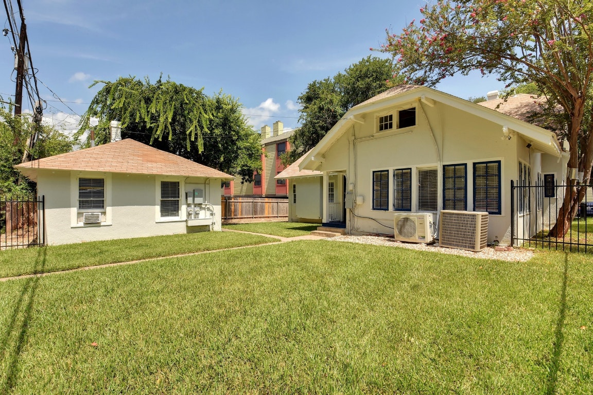903 Shoal Cliff Court Austin, TX 78705 - Photo 30 of 32 a front view of a house with a garden