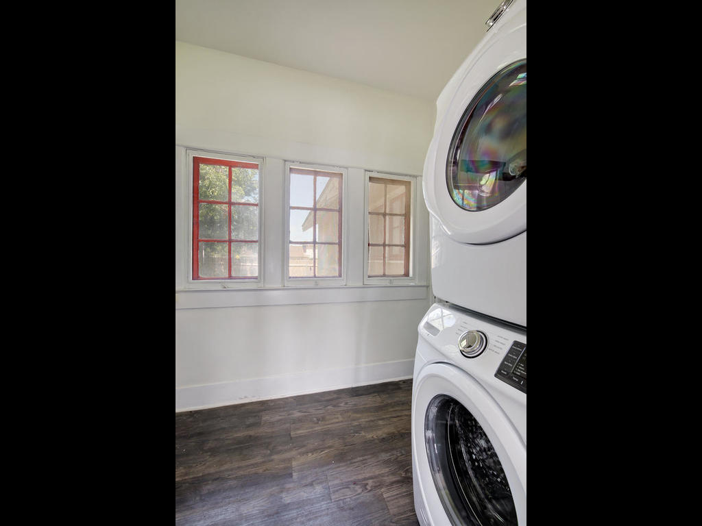 903 Shoal Cliff Court Austin, TX 78705 - Photo 31 of 31 a view of a storage & utility room with dryer and washer