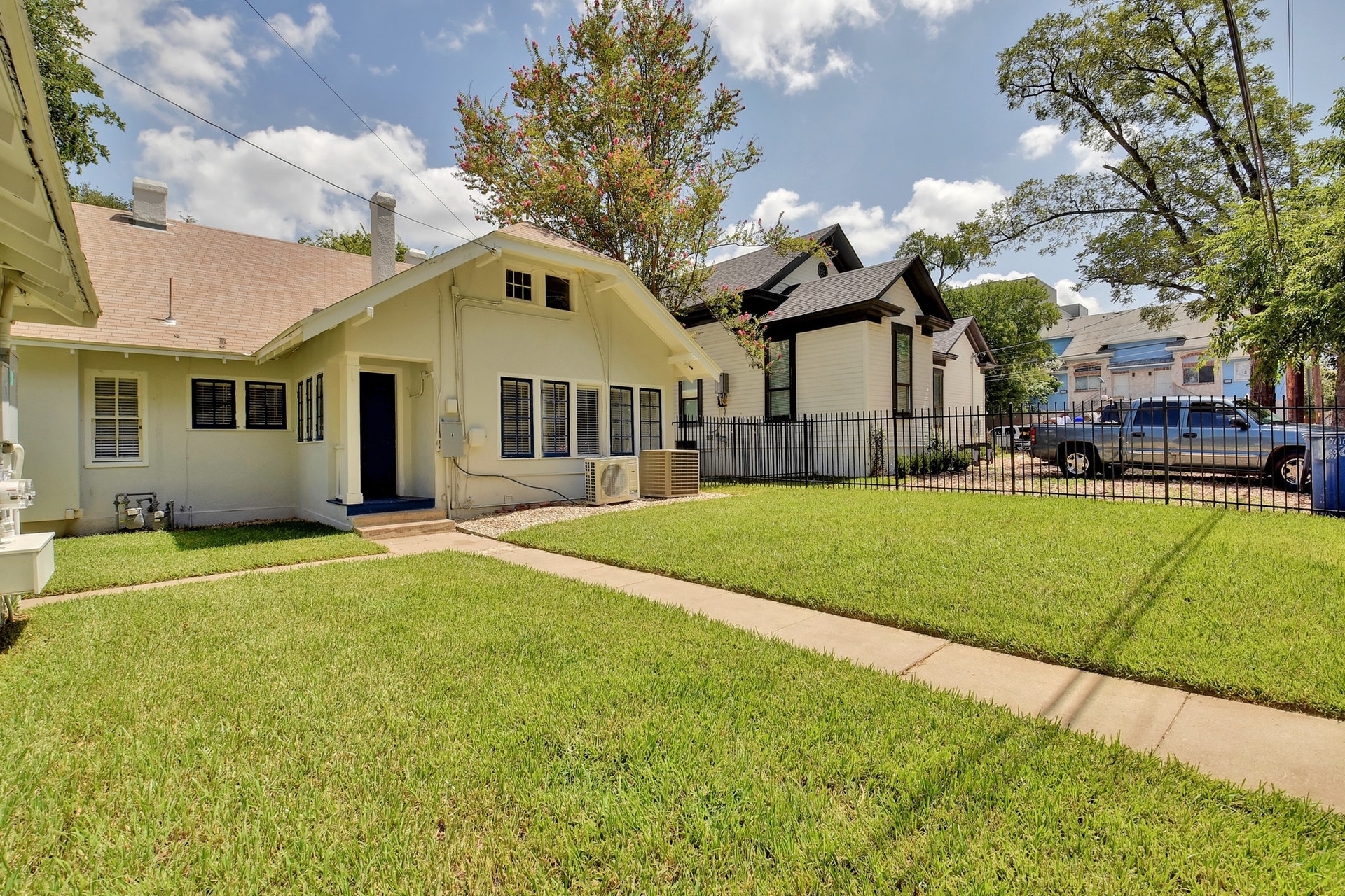 903 Shoal Cliff Court Austin, TX 78705 - Photo 31 of 32 a front view of a house with a yard