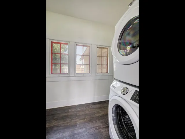 a view of a storage & utility room with dryer and washer