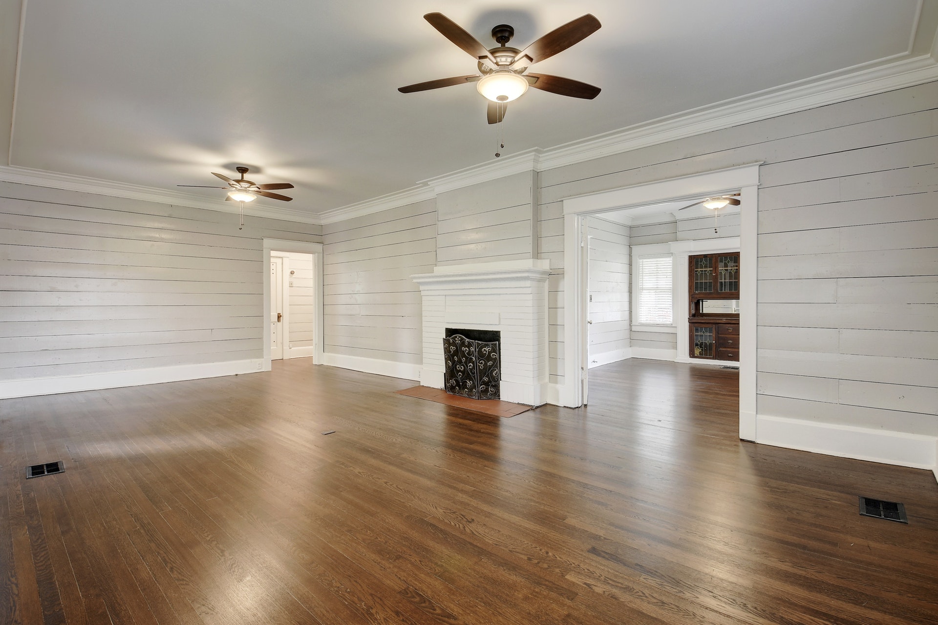 903 Shoal Cliff Court Austin, TX 78705 - Photo 5 of 32 a view of a livingroom with wooden floor a ceiling fan and a window