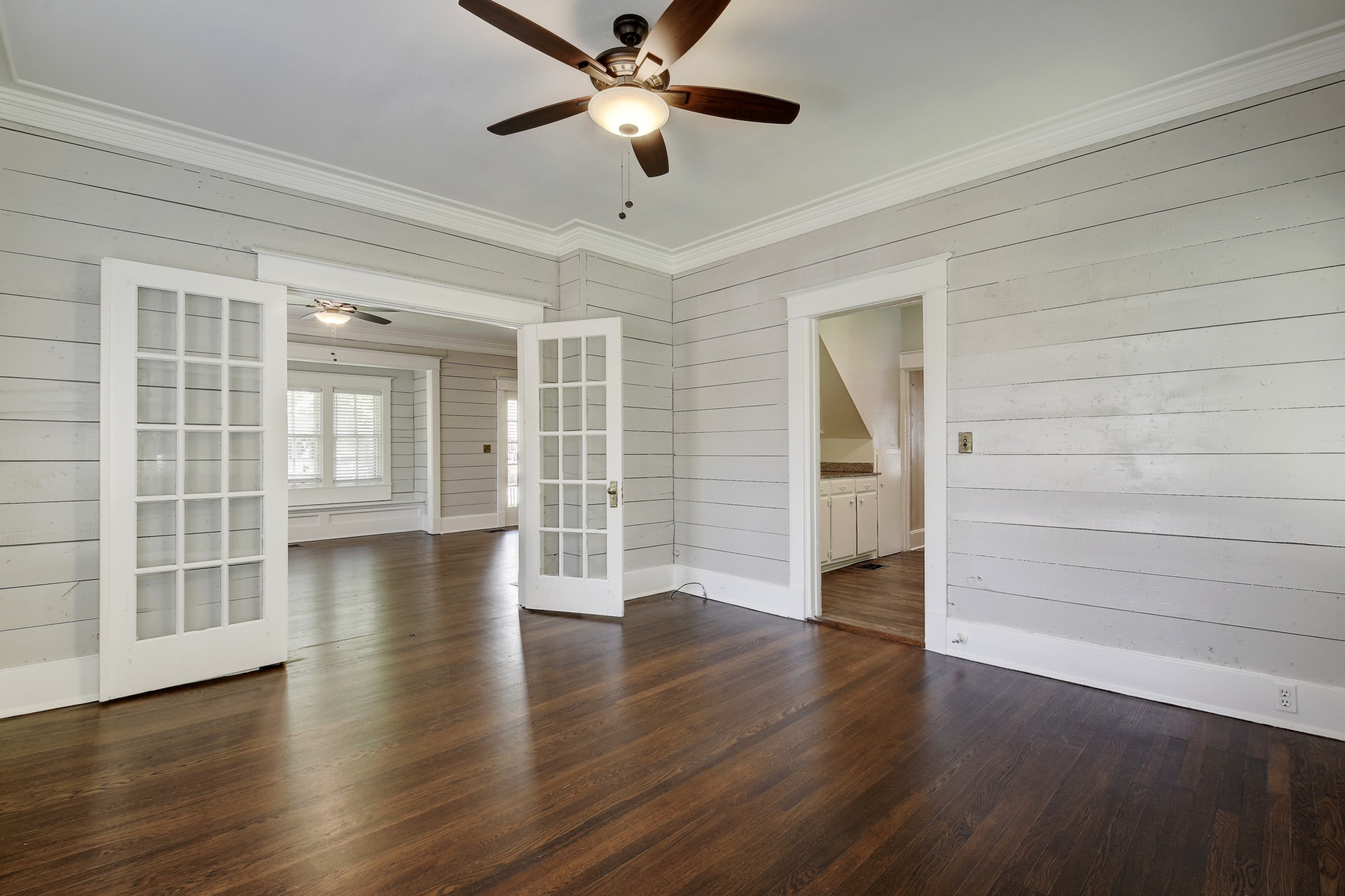 903 Shoal Cliff Court Austin, TX 78705 - Photo 7 of 32 wooden floor in an empty room with a window