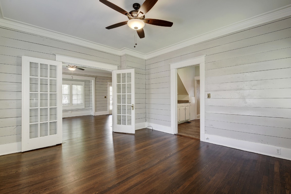 903 Shoal Cliff Court Austin, TX 78705 - Photo 7 of 32 wooden floor in an empty room with a window