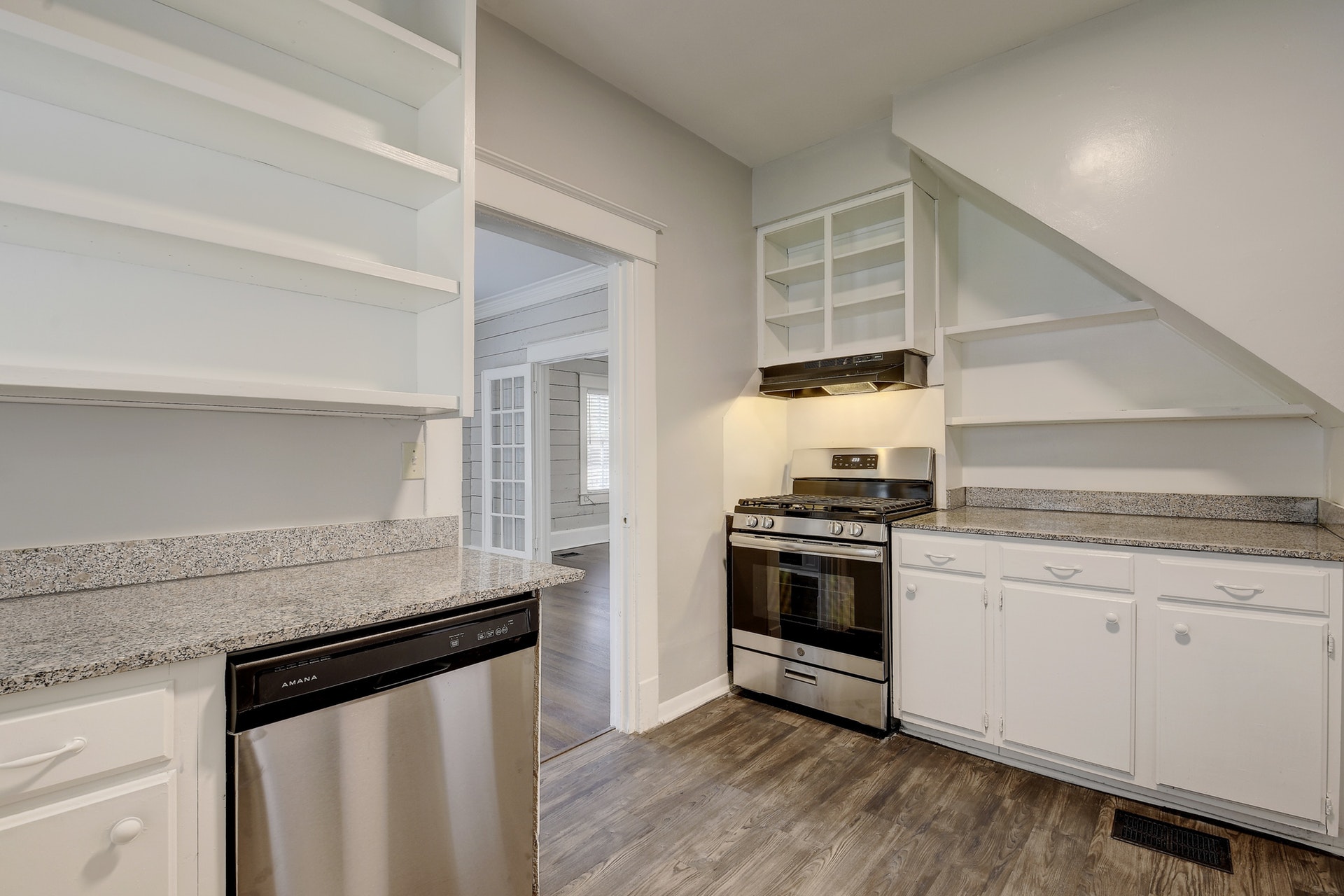 903 Shoal Cliff Court Austin, TX 78705 - Photo 8 of 32 a kitchen with granite countertop a stove and a sink