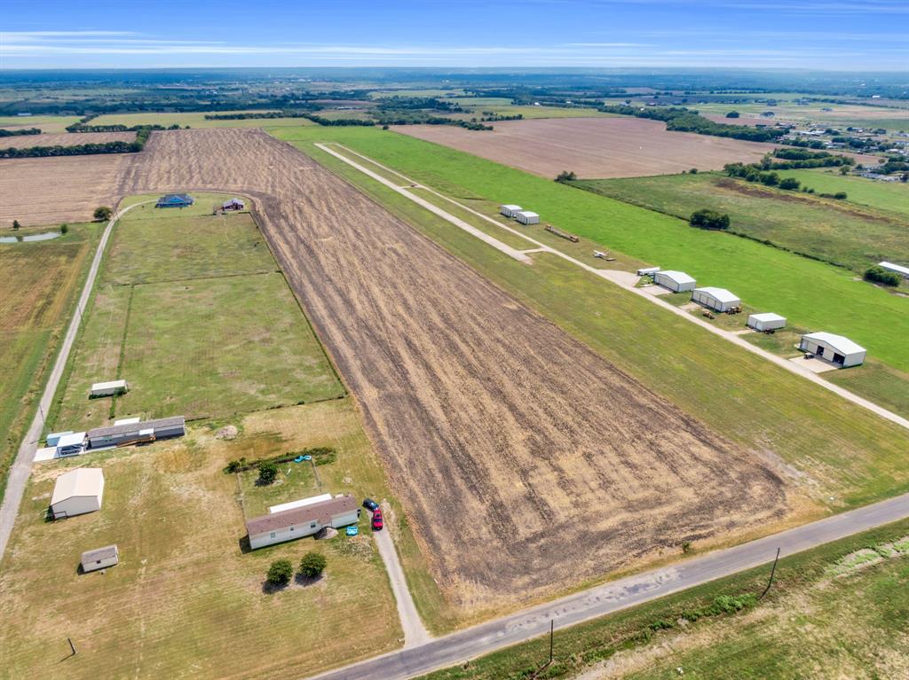 345 North Armstrong Road Venus, TX 76084 - Photo 13 of 18 a view of a swimming pool with a yard