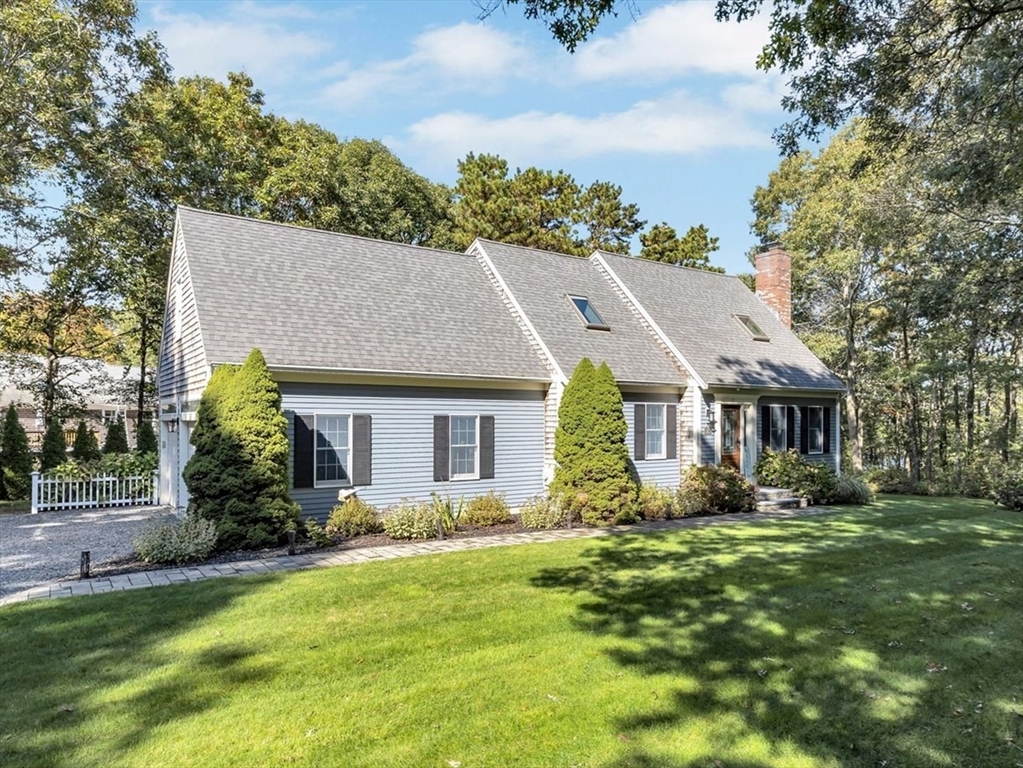 17 Wellfield Road Sandwich, MA 02644 - Photo 1 of 39 a aerial view of a house with a yard and potted plants