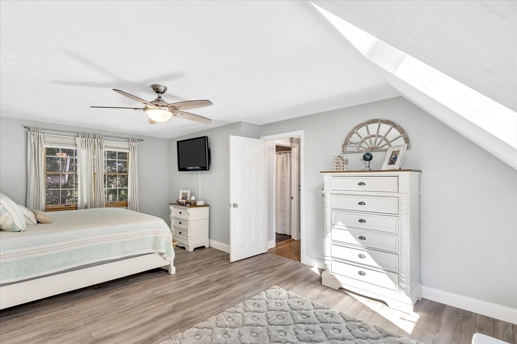 17 Wellfield Road Sandwich, MA 02644 - Photo 17 of 39 a bedroom with a large bed and a tv