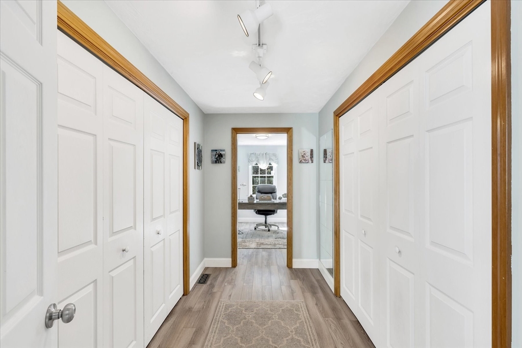 17 Wellfield Road Sandwich, MA 02644 - Photo 20 of 39 a view of a hallway with wooden floor and closet