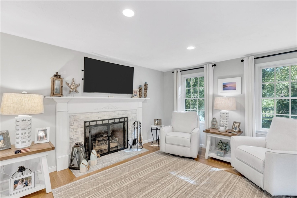 17 Wellfield Road Sandwich, MA 02644 - Photo 2 of 39 a living room with furniture a fireplace and a flat screen tv