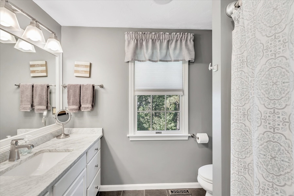 17 Wellfield Road Sandwich, MA 02644 - Photo 24 of 39 a bathroom with a sink a toilet and a mirror