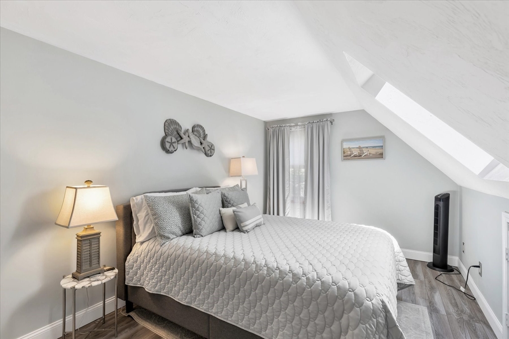 17 Wellfield Road Sandwich, MA 02644 - Photo 28 of 39 a bedroom with a bed and a night stand