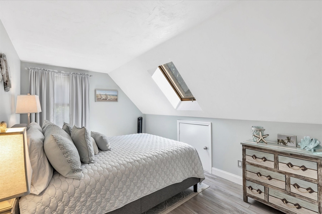 17 Wellfield Road Sandwich, MA 02644 - Photo 29 of 39 a bedroom with a bed and dresser with mirror