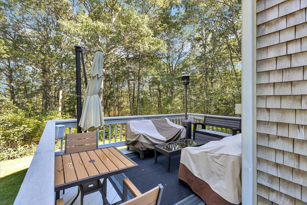 17 Wellfield Road Sandwich, MA 02644 - Photo 31 of 39 a view of balcony with chairs and wooden fence