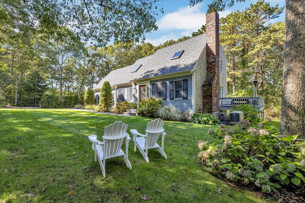 17 Wellfield Road Sandwich, MA 02644 - Photo 37 of 39 a view of a chair and table in backyard of the house