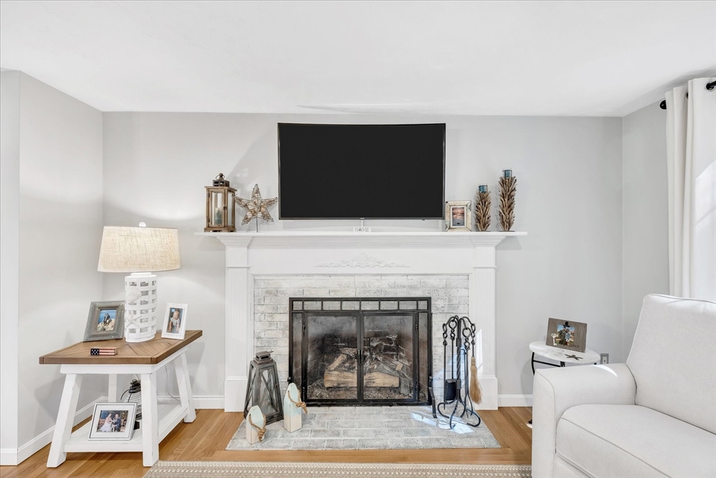 17 Wellfield Road Sandwich, MA 02644 - Photo 4 of 39 a living room with furniture a fireplace and a flat screen tv