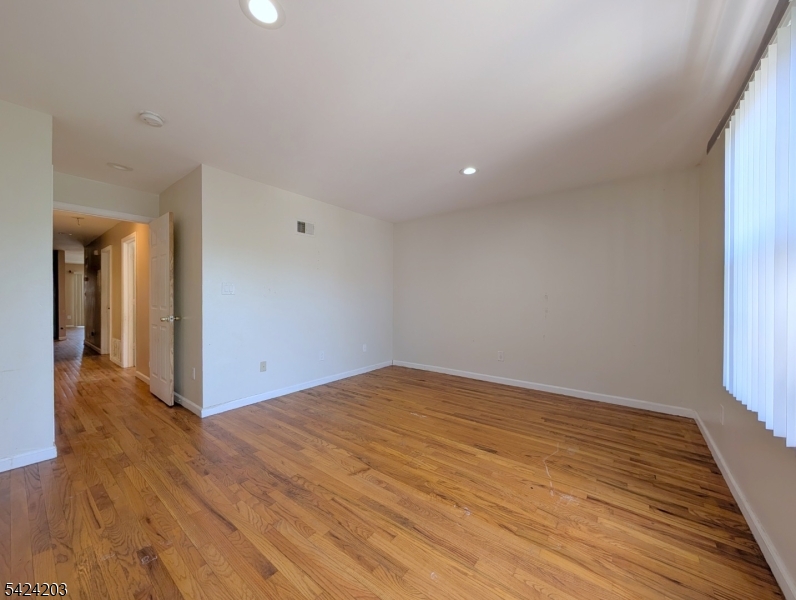 448 Fulton Street Elizabeth Port, NJ 07206 - Photo 11 of 37 a view of an empty room and window
