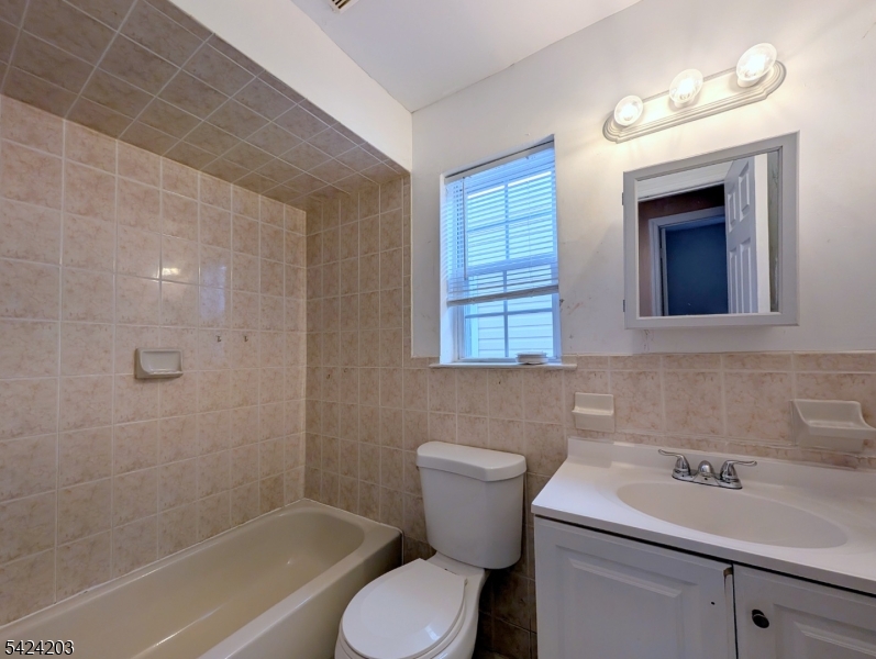 448 Fulton Street Elizabeth Port, NJ 07206 - Photo 15 of 37 a bathroom with a sink toilet and shower