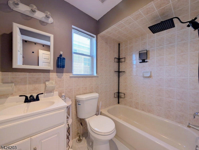 448 Fulton Street Elizabeth Port, NJ 07206 - Photo 25 of 37 a bathroom with a sink a toilet and a bathtub