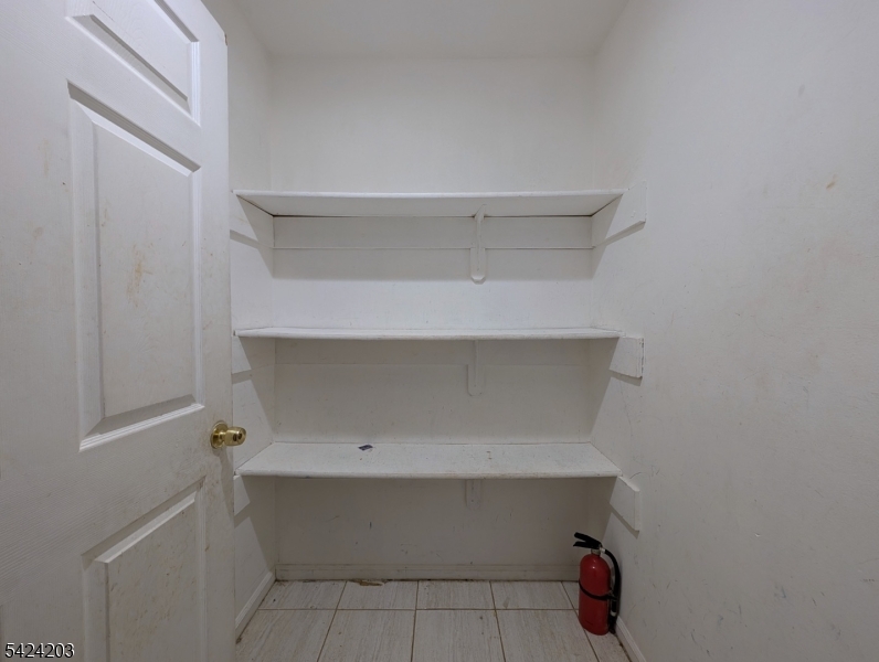448 Fulton Street Elizabeth Port, NJ 07206 - Photo 8 of 37 a view of an empty walk in closet