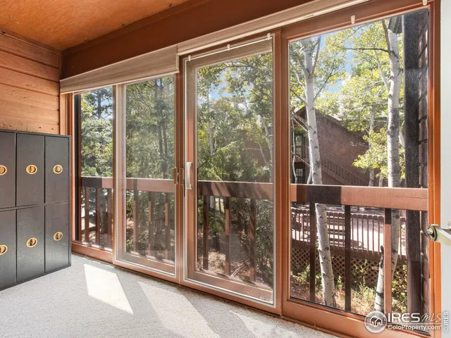 a view of a room with a large window