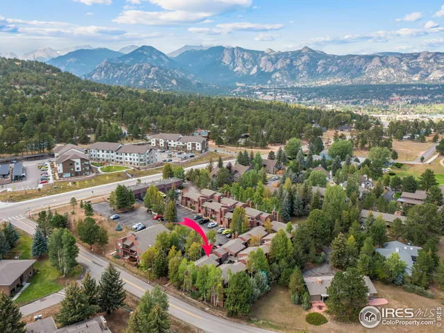 a view of a city with mountains in the background