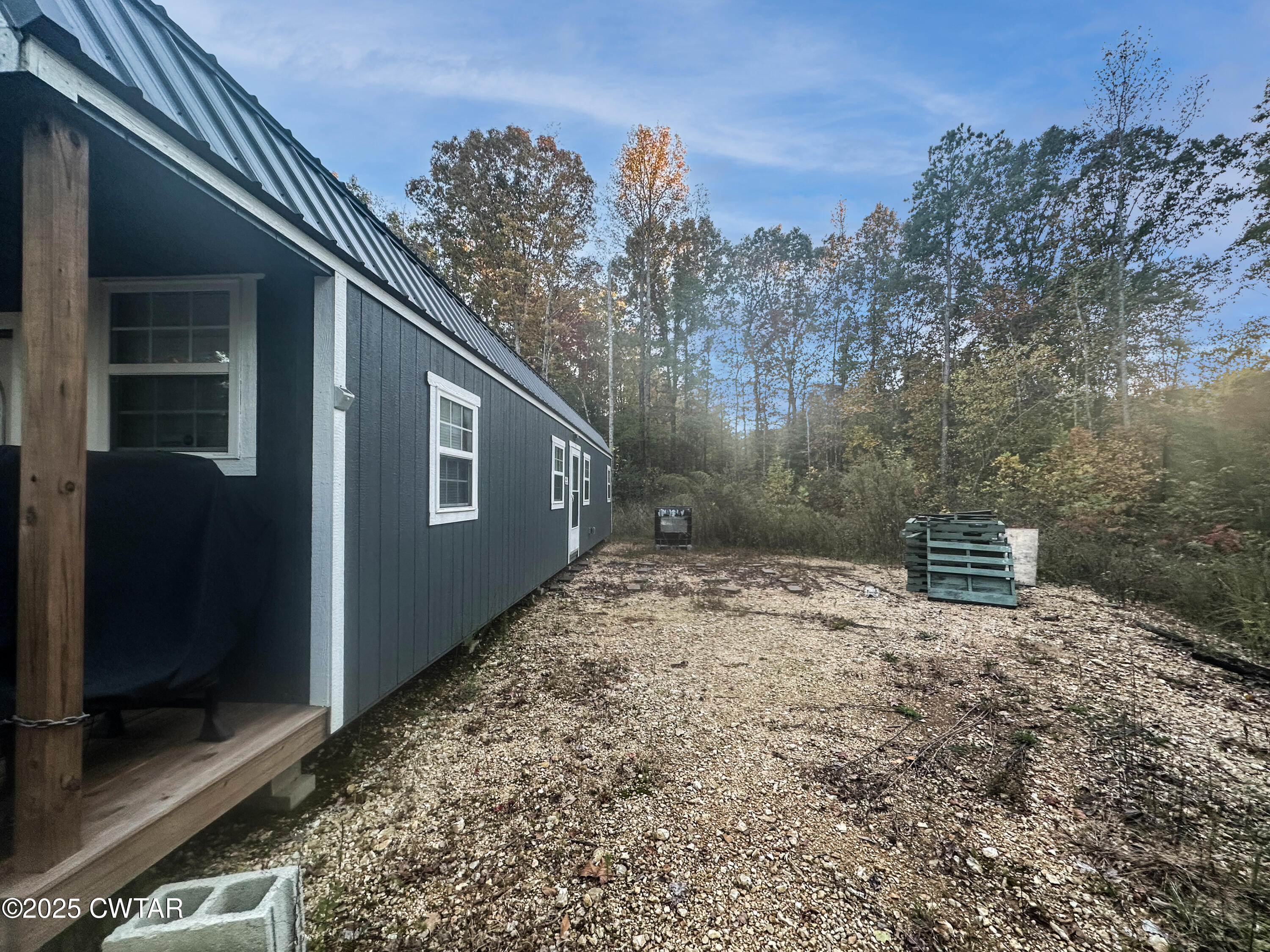 2954 Mt Carmel Road Camden, TN 38320 - Photo 14 of 18 a backyard of a house with lots of green space